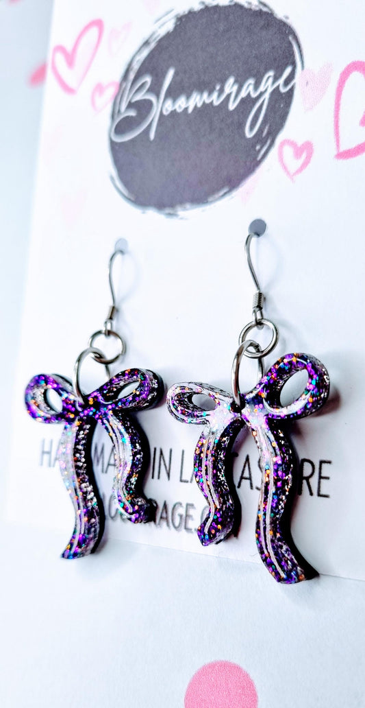 “Purple iridescent bow earrings on ear – lightweight and comfortable